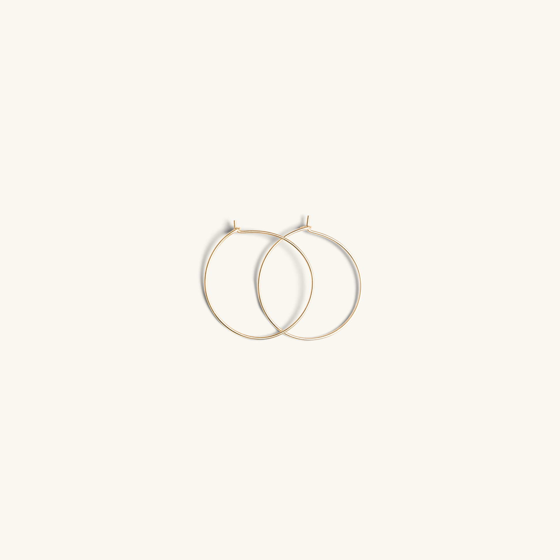 https://www.sarahcameronjewelry.com/cdn/shop/products/Sarah-Cameron-Jewerly-14k-Gold-Filled-Wire-Hoops-25mm-Stacked.png?v=1674670967&width=1946